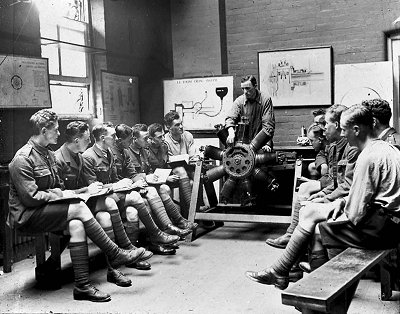 RFC Cadets have the intricacies of a rotary engine explained in the classroom.