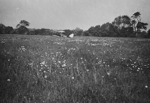 de Haviland Gipsy Moth G-ABAG on the grass at Hawksridge, Denham, on one of the early test flights by Myles Bickerton into the new airfield in 1934.