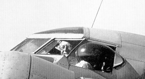 Sidney Cotton in the cockpit of G-AFTL, showing the teardrop window he invented and designed.