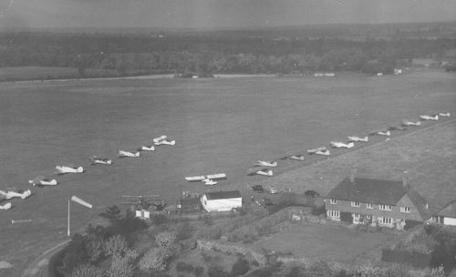 The Denham Flying Club flourished in its larger building, attracting a wide variety of visitors as seen here in October 1952.