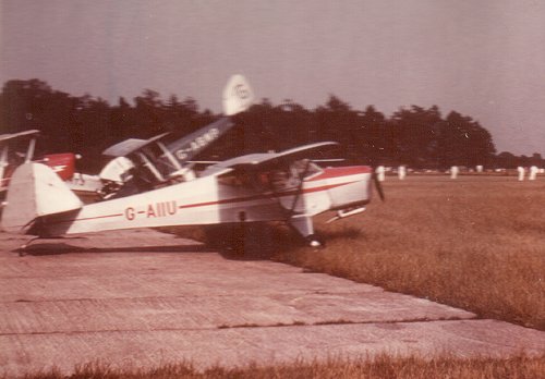 A rare colour photograph of Nightscale's G-AIIU. Note the Wimpey cricketers in the background.