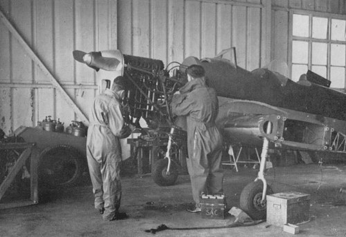 A Miles Magister under maintenance at Denham.