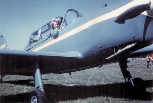 A delighted Beatrice Bickerton in the cockpit of G-APPM.