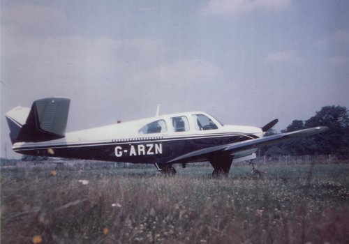 Innes Ireland's butterfly tail Beechcraft N35 Bonanza at Denham in 1965.