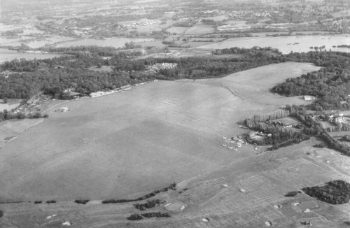 Denham Aerodrome in August of 1969. Due to the difference in mowing, it is possible to make out the shape of the field purchased earlier that year in the right hand corner of the aerodrome, and the L shaped strip around it purchased in 1959.