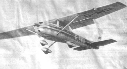 Although grainy, this shot from the local paper shows one of the Police Flying Club aircraft making its bombing run in the flour bombing competition.