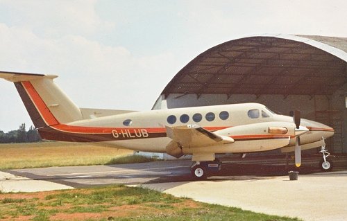 Beechcraft King Air Super 200 G-HLUB outside the blister hangar at Denham.