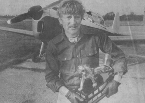Brian Lecomber holding the Esso Tiger Challenge Trophy in front of the Chipmunk he flew to win it, his fourth aerobatic trophy of 1977.