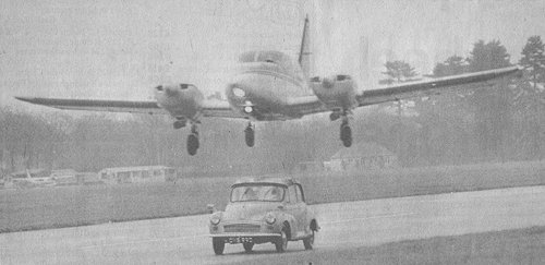 Stuntman Peter Diamond in George and Mildred's Morris Minor has a close shave on Denham's runway for the film version of the popular TV show.