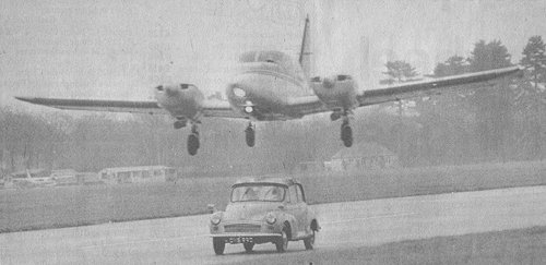 Stuntman Peter Diamond in George and Mildred's Morris Minor has a close shave on Denham's runway for the film version of the popular TV show.