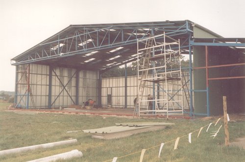 With the structure complete, the fire station and hangar D could be roofed and clad. The tracks for the doors can be seen on the lip of the concrete.