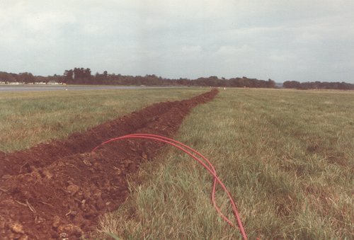 The furrow for the control and power cables ran the entire length of the runway, then across to the control room in the south side office building.