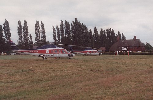 Bristow Helicopters used five Sikorsky S-76s as part of the 1987 Silverstone Shuttle. Two are seen here on the grass in front of Biggles restaurant.