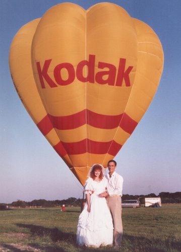 Mr and Mrs P W Long and the hot air balloon they hired for their wedding.