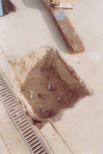 The foundation blocks had inset bolts to allow the structure to be attached.