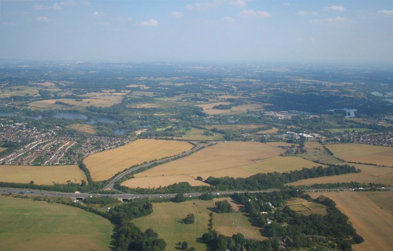 The M25 is in the foreground. The VRP Maple Cross is at end of the slip road.